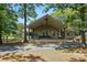 Charming home with a covered porch, bench seating, and a well-maintained front yard at 7204 E 218 Hwy, Marshville, NC 28103