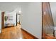 Hallway with hardwood floors, wainscoting, and decor at 7204 E 218 Hwy, Marshville, NC 28103
