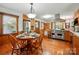 Kitchen and dining area with stainless steel appliances and hardwood floors at 7204 E 218 Hwy, Marshville, NC 28103