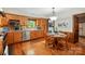 Open kitchen and dining area with wood cabinets and stainless steel appliances at 7204 E 218 Hwy, Marshville, NC 28103