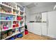 Bright laundry room with shelving, appliances, and ample storage space at 7204 E 218 Hwy, Marshville, NC 28103