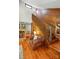Rustic interior with a stone fireplace, wooden stairs, and comfortable seating at 7204 E 218 Hwy, Marshville, NC 28103