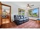 Comfortable living room with a leather sofa, natural light, and direct access to the kitchen at 7204 E 218 Hwy, Marshville, NC 28103