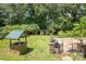 Close-up on backyard with a stone well and patio area with grilling station at 749 N Miller Ave, Statesville, NC 28677