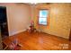 Empty bedroom with hardwood floors and vintage wallpaper design at 749 N Miller Ave, Statesville, NC 28677