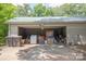 Open garage area with various boxes, bins, and home maintenance items at 749 N Miller Ave, Statesville, NC 28677