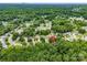 This aerial view pinpoints the property in a verdant neighborhood, showcasing its proximity to surrounding trees at 8120 Vermilion Dr, Charlotte, NC 28215