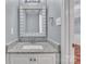 Stylish powder room featuring granite countertops and a decorative mirror at 8120 Vermilion Dr, Charlotte, NC 28215