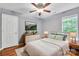 Bright bedroom with neutral decor, wood floors, a ceiling fan and a comfortable bed at 8120 Vermilion Dr, Charlotte, NC 28215