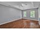 Spacious bedroom with hardwood floors, high ceilings, and ample natural light at 8120 Vermilion Dr, Charlotte, NC 28215