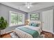 Bedroom showcasing hardwood floors, large window, comfortable bed, and natural light at 8120 Vermilion Dr, Charlotte, NC 28215