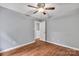 Bedroom with hardwood floors, neutral paint, and an open closet at 8120 Vermilion Dr, Charlotte, NC 28215