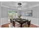 Elegant dining room with stylish lighting, a decorative rug, and a large window at 8120 Vermilion Dr, Charlotte, NC 28215