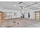 Spacious two-car garage featuring ample storage, built-in shelving, and convenient access to the home at 8120 Vermilion Dr, Charlotte, NC 28215
