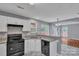 Bright kitchen featuring granite countertops, white cabinets, and an open layout at 8120 Vermilion Dr, Charlotte, NC 28215