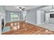 An expansive living room features hardwood floors, fireplace, and ample natural light at 8120 Vermilion Dr, Charlotte, NC 28215