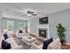 Comfortable living room with a fireplace, modern furniture, and hardwood floors at 8120 Vermilion Dr, Charlotte, NC 28215