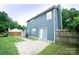 Spacious backyard with a concrete patio area and a wooden fence at 8125 Sheringham Way, Charlotte, NC 28227