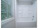 Bright bathroom showcasing a tile surround shower and tub combination at 8125 Sheringham Way, Charlotte, NC 28227