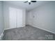 Bedroom with large closet, neutral paint and plush carpet at 8125 Sheringham Way, Charlotte, NC 28227