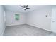 Empty, freshly painted bedroom with a window and new carpet at 8125 Sheringham Way, Charlotte, NC 28227