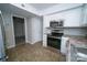 Kitchen featuring stainless steel appliances and a view of the dining area at 8125 Sheringham Way, Charlotte, NC 28227