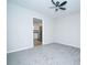 Cozy room with carpet, a ceiling fan, and a view of the kitchen at 8125 Sheringham Way, Charlotte, NC 28227