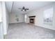Bright living room with a brick fireplace, ceiling fan, and neutral paint at 8125 Sheringham Way, Charlotte, NC 28227