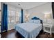 Comfortable bedroom with large windows, hardwood floors, and stylish decor at 840 Pecan Tree Ln, Fort Mill, SC 29715