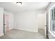 Bedroom with neutral decor featuring a carpeted floor and a walk-in closet at 8521 Aspen Ct, Charlotte, NC 28227