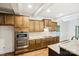 Modern kitchen featuring stainless steel appliances, granite countertops, and custom cabinetry at 8521 Aspen Ct, Charlotte, NC 28227