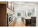 Spacious kitchen with stainless steel appliances, granite countertops, and hardwood floors at 8521 Aspen Ct, Charlotte, NC 28227