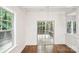 Bright living area with hardwood floors, shiplap wall and access to an outdoor deck at 8521 Aspen Ct, Charlotte, NC 28227