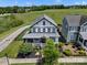 An aerial shot showcases the home's curb appeal with its inviting front porch and mature landscaping at 909 Herrons Ferry Rd, Rock Hill, SC 29730