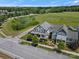 An aerial view shows the home's setting near a lush green space, highlighting its desirable location at 909 Herrons Ferry Rd, Rock Hill, SC 29730