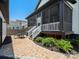Fenced in backyard with a brick patio, outdoor furniture, lush landscaping, and a screened-in porch at 909 Herrons Ferry Rd, Rock Hill, SC 29730