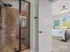 Modern shower featuring custom tilework with an attached bedroom that has natural light at 909 Herrons Ferry Rd, Rock Hill, SC 29730