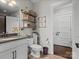 Modern bathroom with custom shelving, neutral decor, and a spacious vanity at 909 Herrons Ferry Rd, Rock Hill, SC 29730