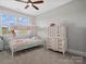 Bright bedroom with a bunk bed, dresser, large windows, and natural light for a cozy feel at 909 Herrons Ferry Rd, Rock Hill, SC 29730