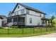 Back exterior of home with screened-in porch, fenced yard, patio area and lush landscaping at 909 Herrons Ferry Rd, Rock Hill, SC 29730