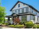 Two-story home with white siding, black trim, landscaped front yard, and welcoming porch at 909 Herrons Ferry Rd, Rock Hill, SC 29730