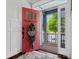 Charming foyer featuring a decorative rug, and a peek through the open door to the porch at 909 Herrons Ferry Rd, Rock Hill, SC 29730