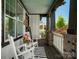 Cozy front porch featuring rocking chairs, black and white rug, and view of neighborhood at 909 Herrons Ferry Rd, Rock Hill, SC 29730