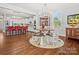 Open kitchen and dining area with a large island, modern appliances, and stylish decor at 909 Herrons Ferry Rd, Rock Hill, SC 29730