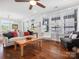 Bright living room with hardwood floors, comfortable seating, and large windows offering lots of natural light at 909 Herrons Ferry Rd, Rock Hill, SC 29730