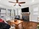 Cozy living room featuring a fireplace, large windows, hardwood floors, and comfortable seating at 909 Herrons Ferry Rd, Rock Hill, SC 29730
