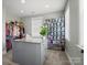 Spacious walk-in closet with custom shelving, drawers, and center granite top island for organization at 909 Herrons Ferry Rd, Rock Hill, SC 29730