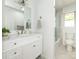 Bright bathroom with a marble top vanity, framed mirror, updated fixtures, and a glass door shower at 9300 Surrey Rd, Mint Hill, NC 28227