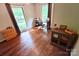 Bedroom with lots of natural light, a ceiling fan, and hardwood floors, perfect for relaxation or study at 9300 Surrey Rd, Mint Hill, NC 28227
