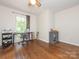 Bedroom with hardwood floors, ceiling fan, and lots of natural light, providing a serene living space at 9300 Surrey Rd, Mint Hill, NC 28227